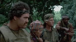 Scène du film Uncommon Valor (1983) avec Gene Hackman — une équipe de soldats prête à franchir le point de non-retour, illustration parfaite de l'expression 'see you on the other side'